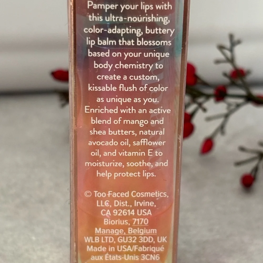 Too Faced Peach Bloom Color Blossomny Lip Balm - color is Lilac Bloom